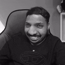 a black and white photo of a man wearing a shirt that says jd on it