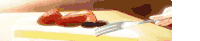 a person is holding a fork over a plate of strawberries and plums .