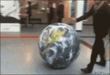 World Coming At You GIF - Kidfails Kick Globe GIFs