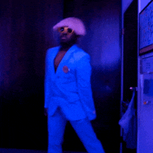 a blurry photo of a man in a blue suit dancing