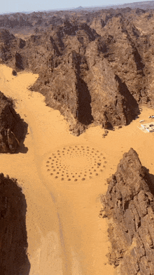 an aerial view of a desert landscape with mountains