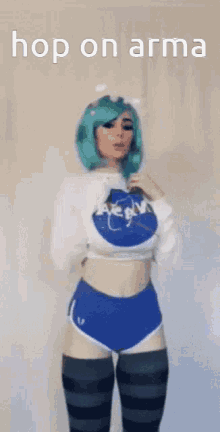 a woman with green hair is wearing a nasa sweater and shorts