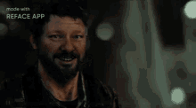 a man with a beard is smiling and looking at the camera with the words made with reface app above him .