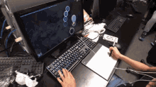 a person is playing a video game on an acer monitor