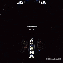 a sign that says john cena is lit up in a dark room