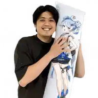 a man in a black shirt is holding a pillow with a picture of a girl on it