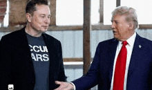 elon musk and donald trump are shaking hands in a building .