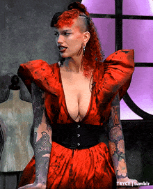 a woman with red hair is wearing a very revealing red dress