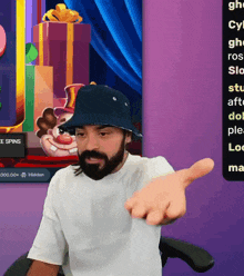 a man wearing a hat points to a screen that says free spins on it
