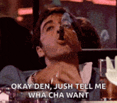 a man smoking a cigar with the words okay den jush tell me wha cha want below him
