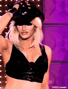 a woman is wearing a hat and gloves and has the word tumblr on the bottom of the image