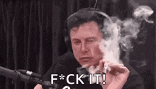 elon musk is smoking a cigarette in front of a microphone and says f * ck it !