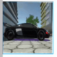 a black sports car is parked on a sidewalk in front of a building .