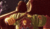 a cartoon character is holding a sword and wearing a green shirt