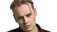 a close up of a man 's face with his eyes closed