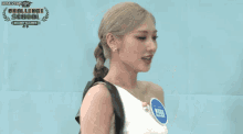 a girl is standing in front of a sign that says challenge school secret number