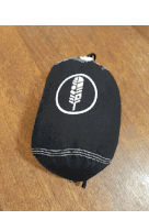a small black item with a white feather on it