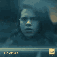 a poster for the flash shows a man in a black suit