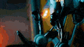 a close up of a robot 's arm with a red light behind it