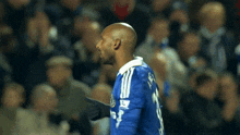 a man wearing a blue shirt with the number 30 on it