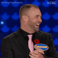 a man with a name tag that says jonathan laughs