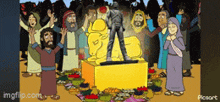 a group of people standing around a statue of jesus