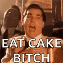 a man in a suit and tie is screaming with his mouth open and the words `` eat cake bitch '' .