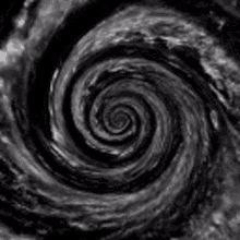 a black and white photo of a spiral in space .