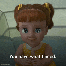 a disney pixar doll is sitting on a couch and says " you have what i need "