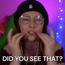 a woman wearing glasses and a beanie is asking if she did you see that