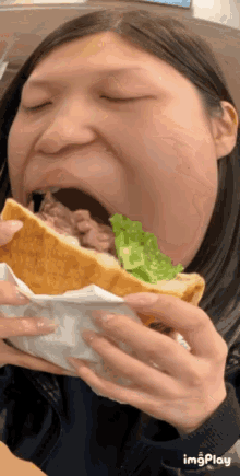 Louise Yuan Eating GIF - Louise Yuan Eating Sandwich GIFs