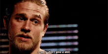 a man with a beard is saying `` i really don 't give a shit . ''