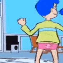 a cartoon character with blue hair and pink underwear is standing in a room holding a remote control .