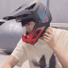 a man wearing a helmet that says ' fox racing ' on it