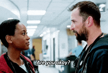 a man and a woman are looking at each other and the man is asking the woman if she is ok