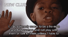 a young boy wearing a hat says " i do solemnly swear to be a he-man " and " hate women "