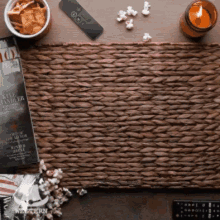 a wicker place mat with a magazine and a remote