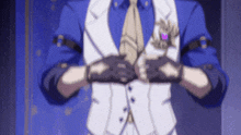 a man in a suit and tie is wearing gloves and adjusting his tie .