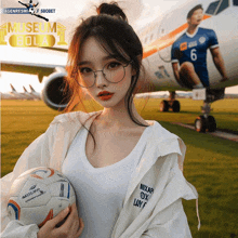 a girl holding a soccer ball in front of an airplane that says museum bola on it