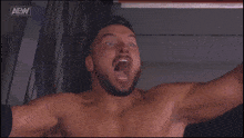 a man with a beard says " i am the greatest " in front of an aew logo