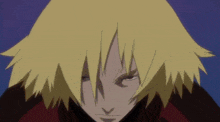 a close up of a person 's face with yellow hair and a red jacket