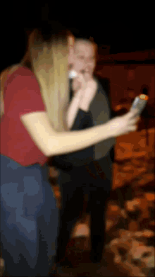 a blurry picture of a woman taking a selfie