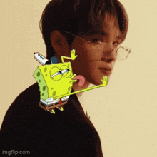 a man wearing glasses has a spongebob squarepants sticker on his face