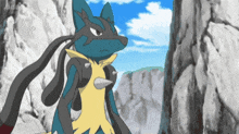a blue and yellow pokemon standing in front of a rocky cliff .