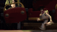 buzz lightyear from toy story is running in front of a toy car .