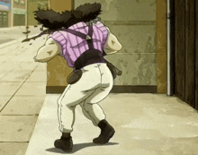 a man in a purple shirt and white pants is standing on a sidewalk .