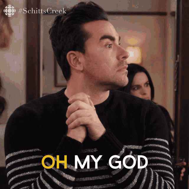 a man in a black and white striped sweater says 