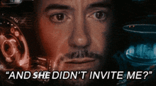 a close up of a man 's face with the words `` and she did n't invite me ''