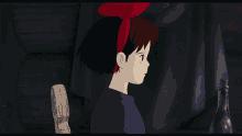 a little girl with a red bow in her hair