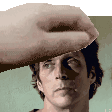 a close up of a man 's face with a hand covering his eyes .